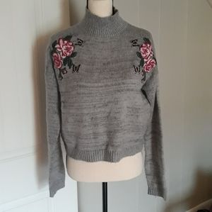 Embroidered mock neck sweater